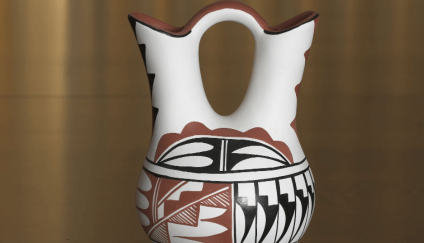 A traditional stone-polished white and black geometric Native American wedding vase.